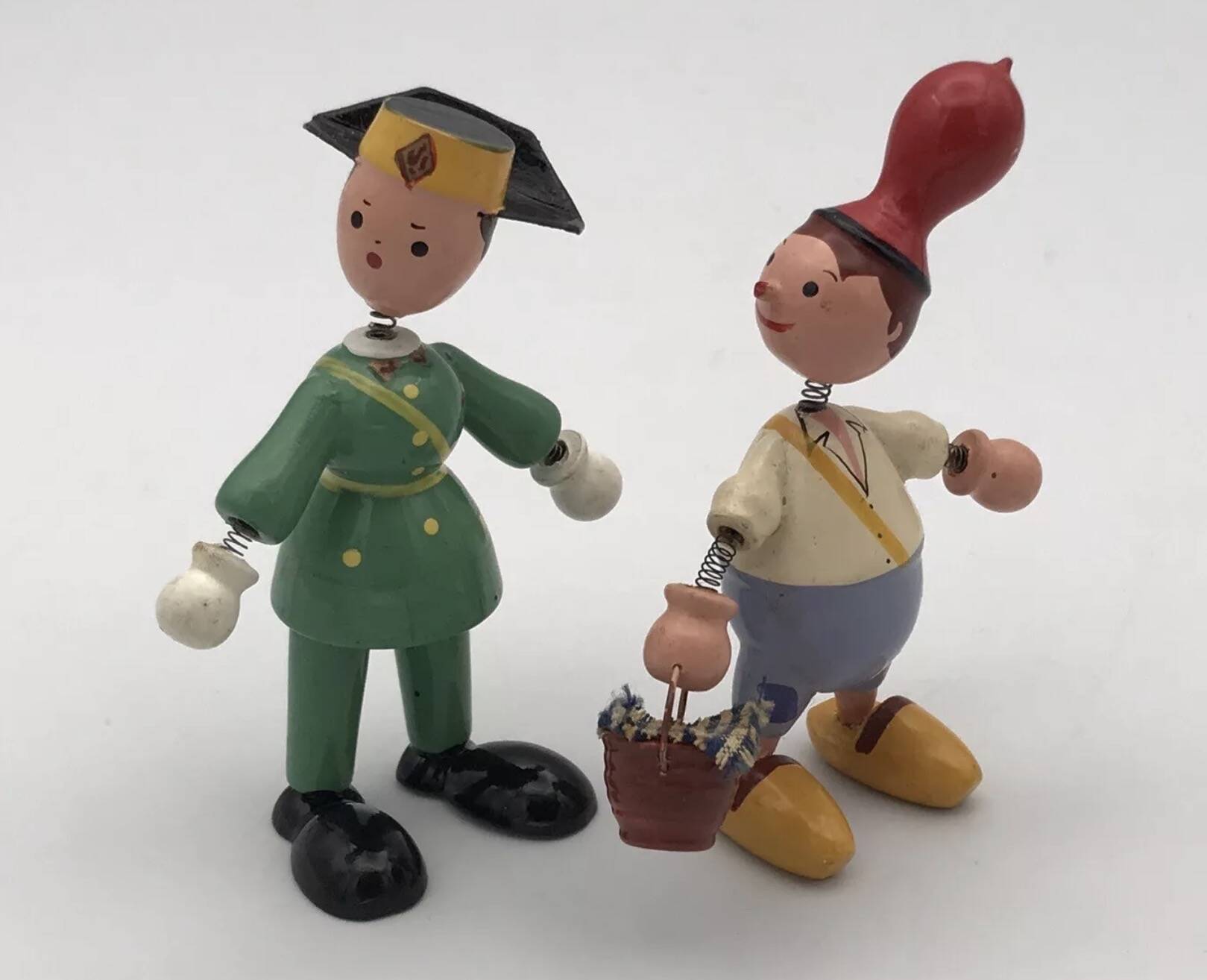 Set of 2 vintage GOULA wooden toy figurines with spring.
