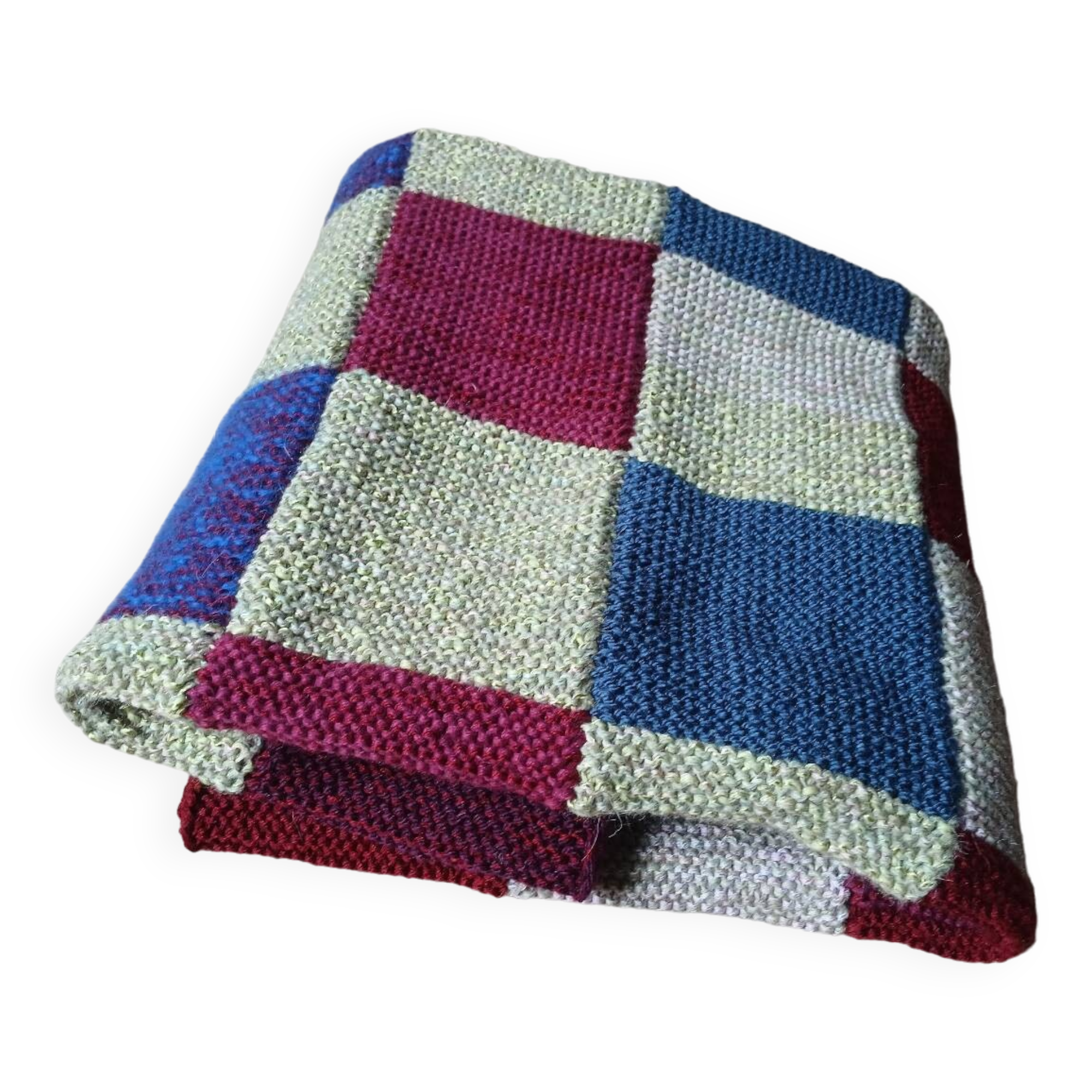 Hand knitted patchwork plaid