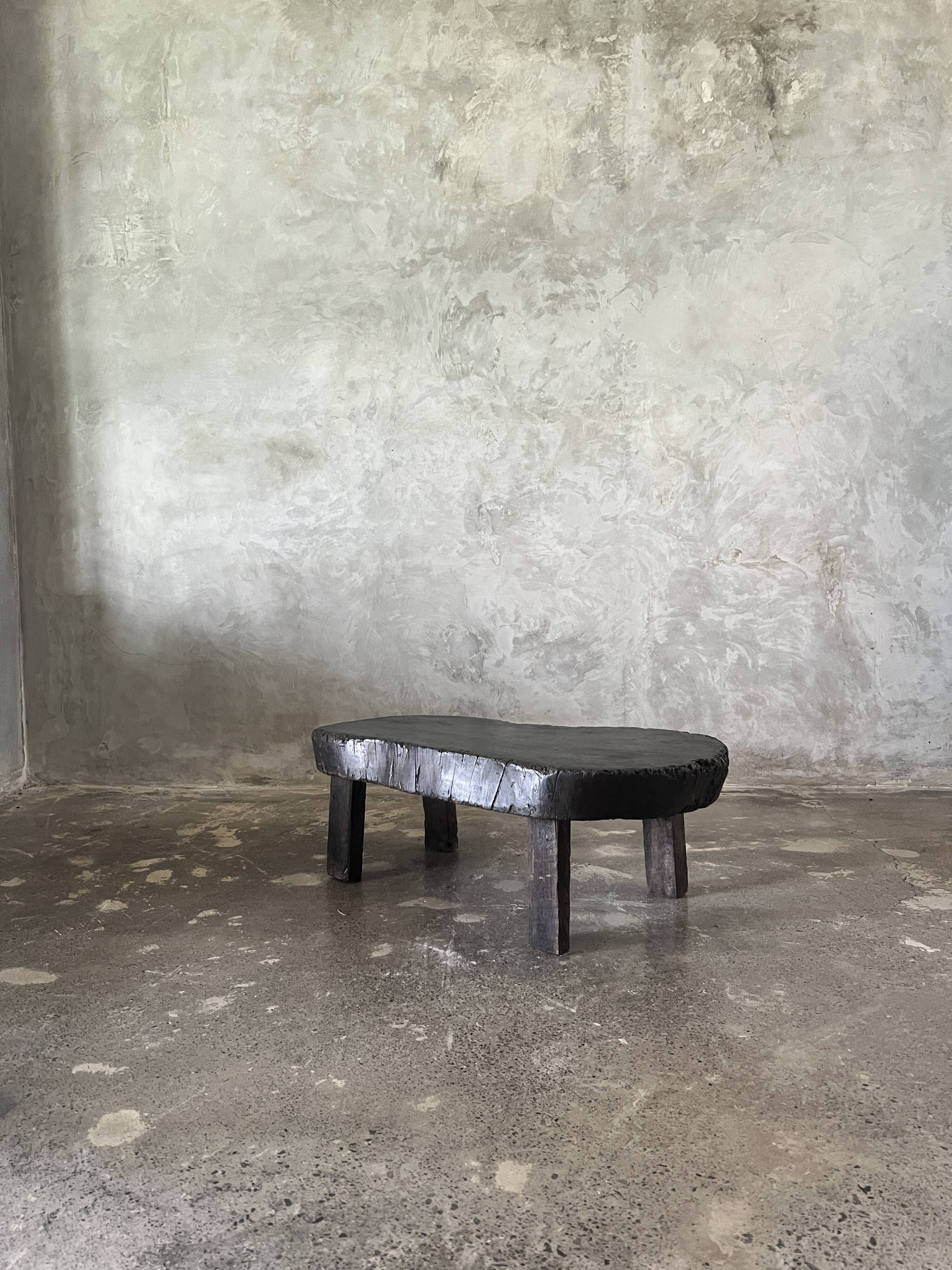 Small old Asian wooden coffee table in Japanese style, kidney-shaped top