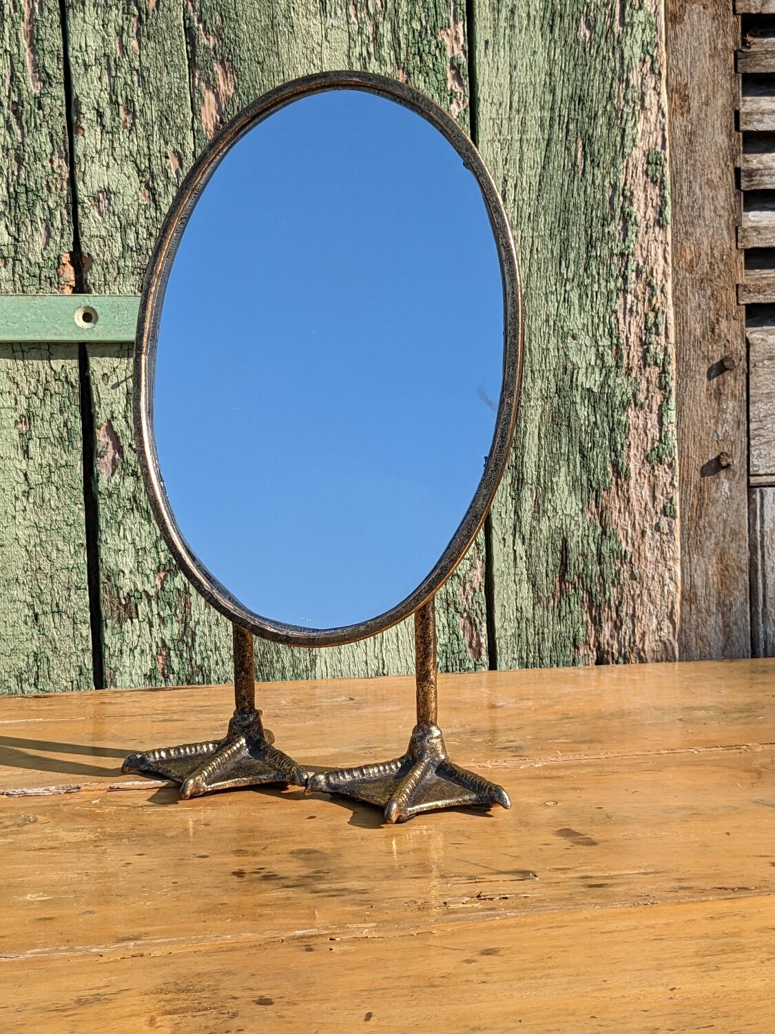 Metal mirror with duck legs
