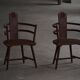 Pair of Scandinavian wooden armchairs with hand-carved folk motifs, 1920s.