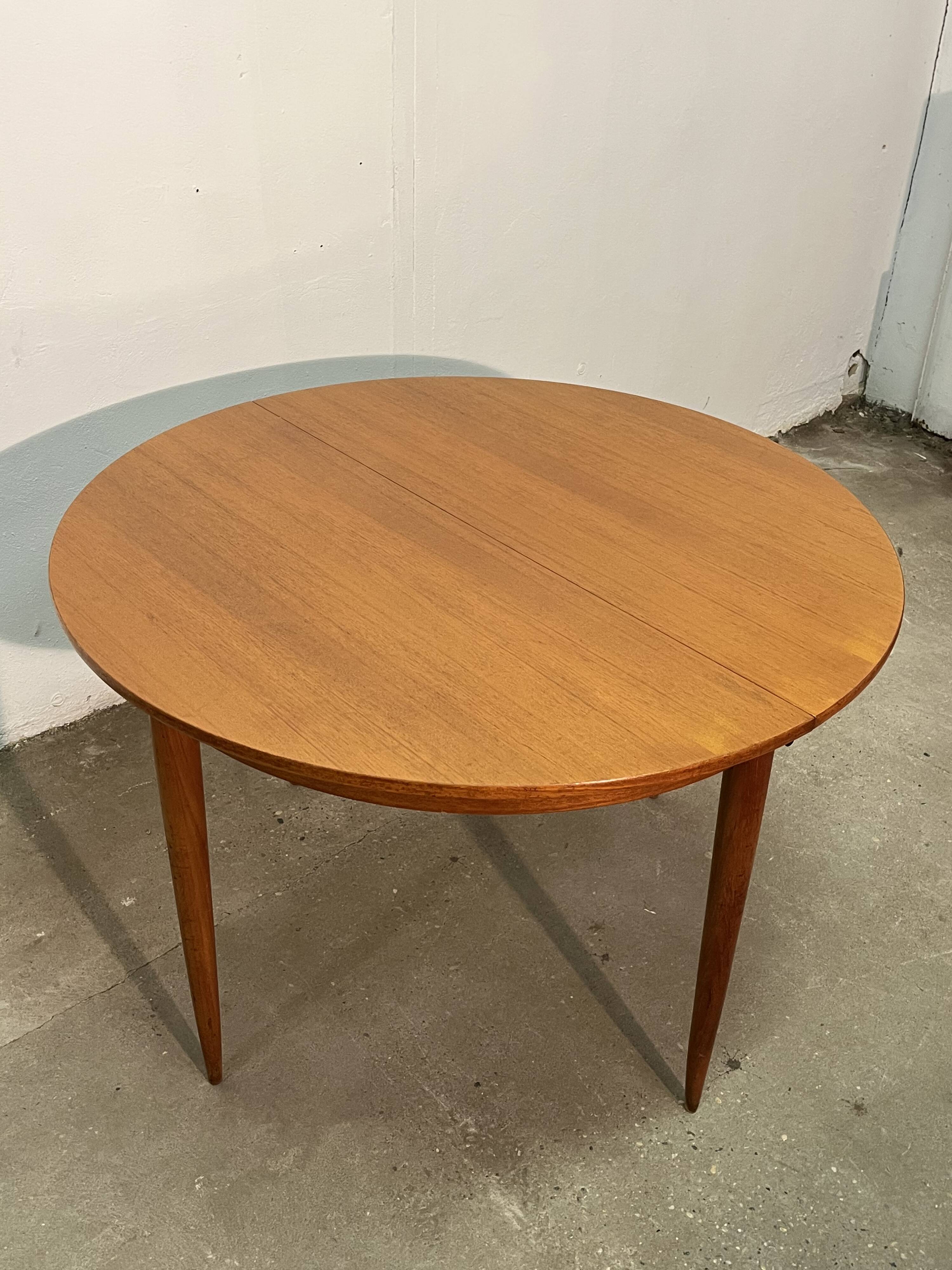 Vintage 1960s teak extendable Scandinavian table.