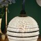Applique coudée globe vintage en verre de Clichy blanc et doré