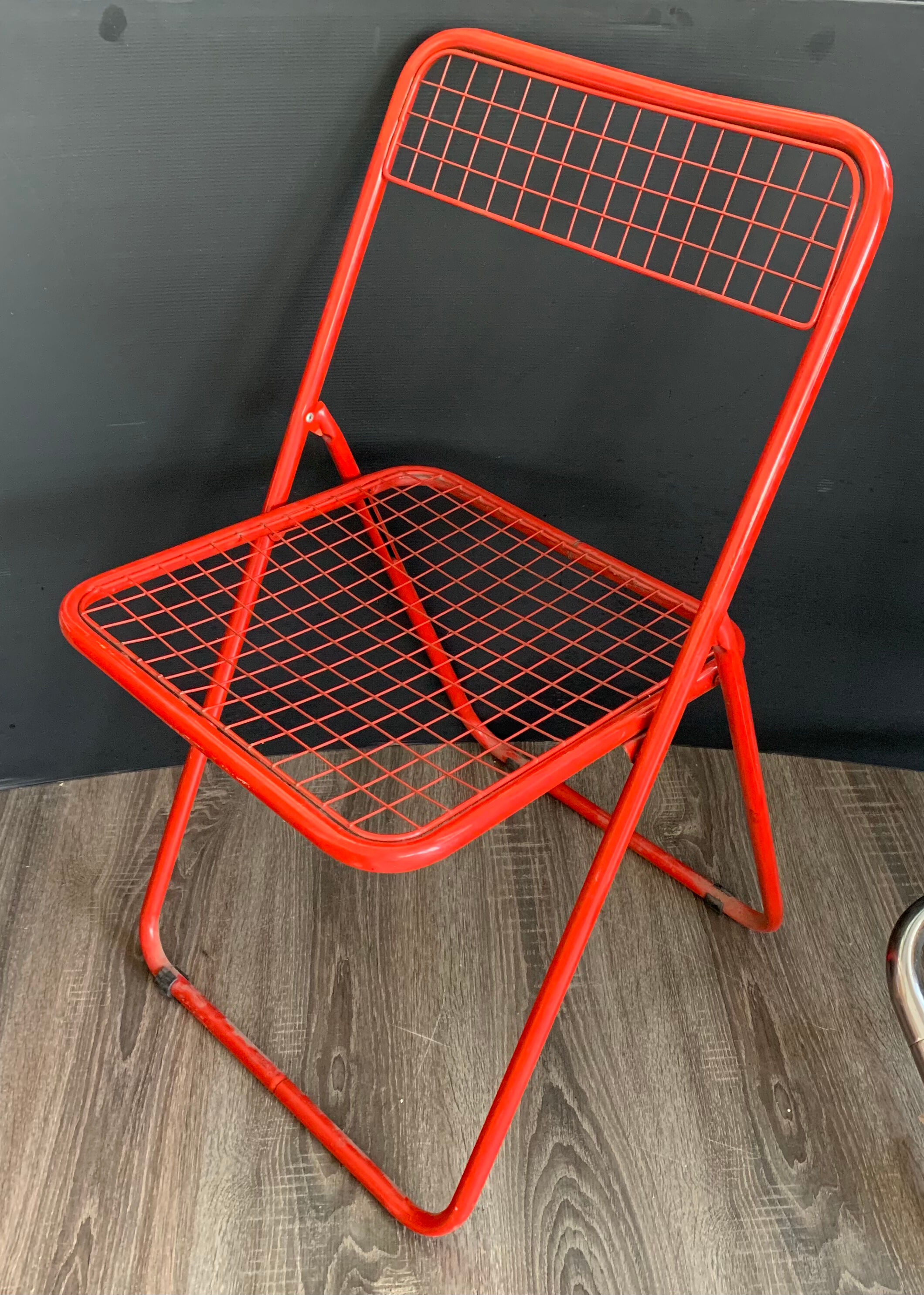 Red "Ted Ned" folding chair by Niels Gammelgaard