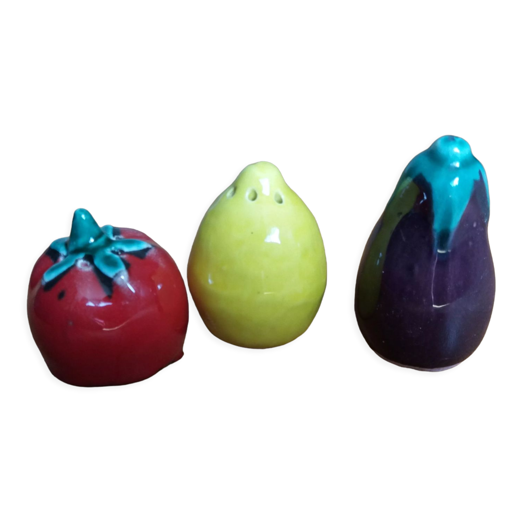 Trio salt shakers pepper vegetables and fruits in slip