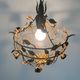 Patinated metal ceiling light with a floral and leaf pattern, 1950s, Italy.