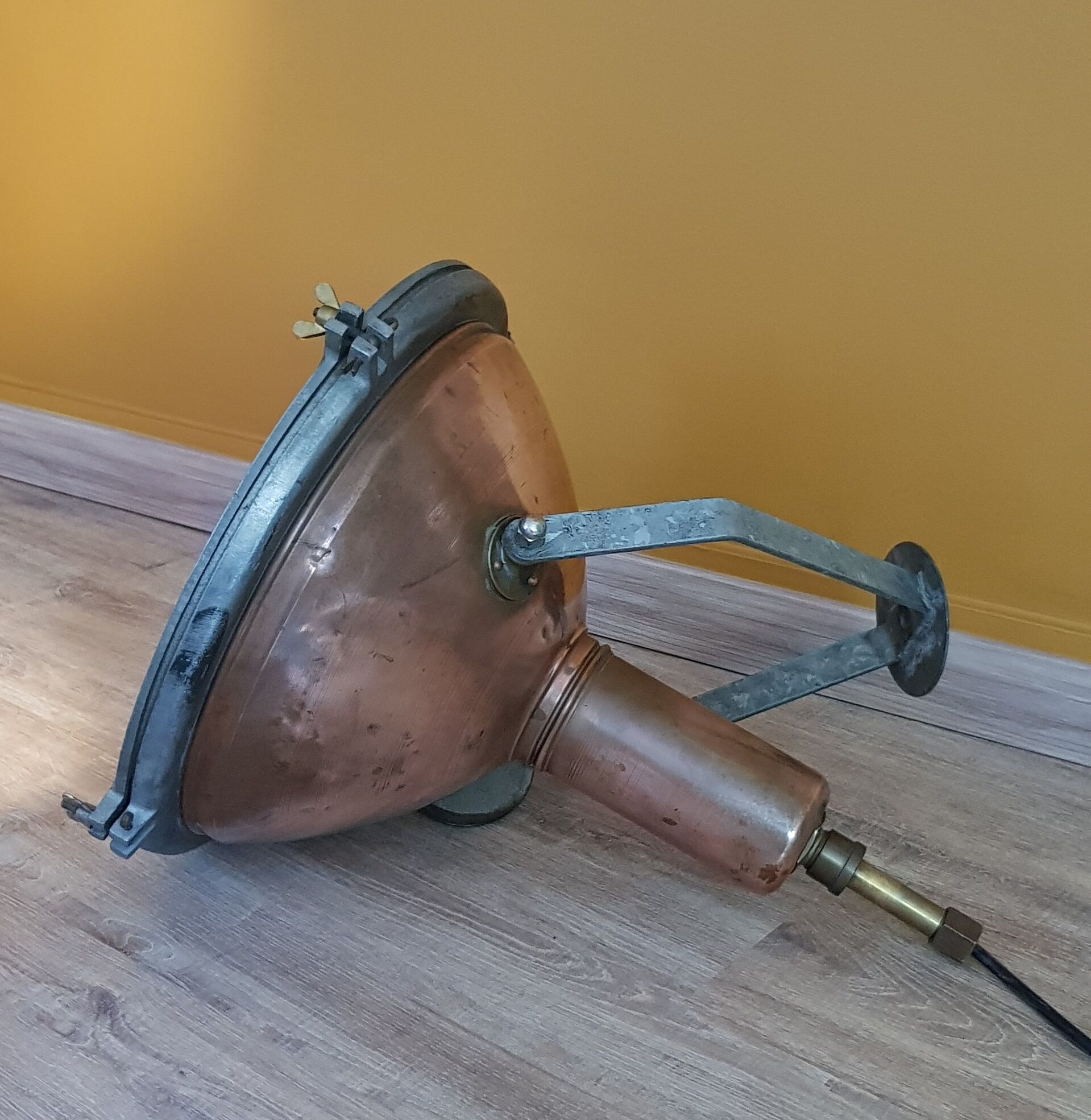 Old brass boat headlight with Holophane interior glass