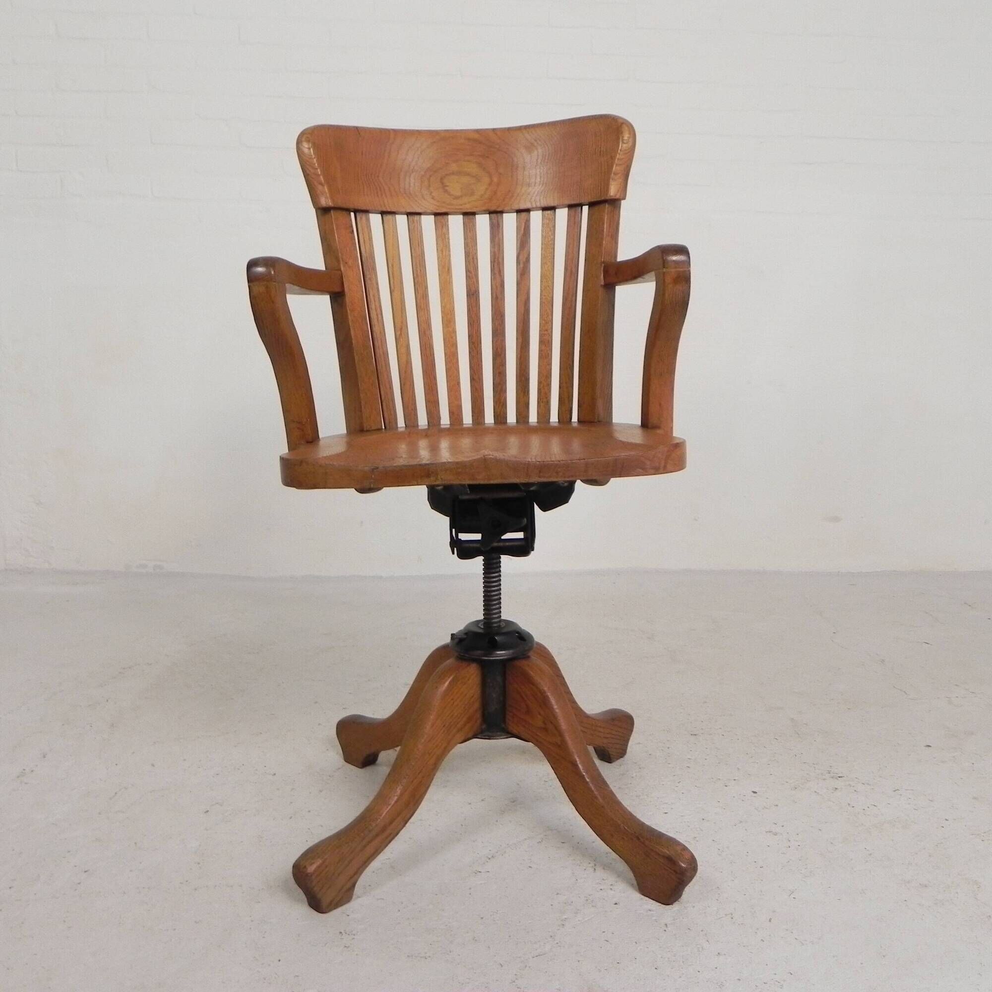 Oak office chair with adjustable spring system and height adjustment, 1950s.