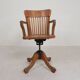 Oak office chair with adjustable spring system and height adjustment, 1950s.