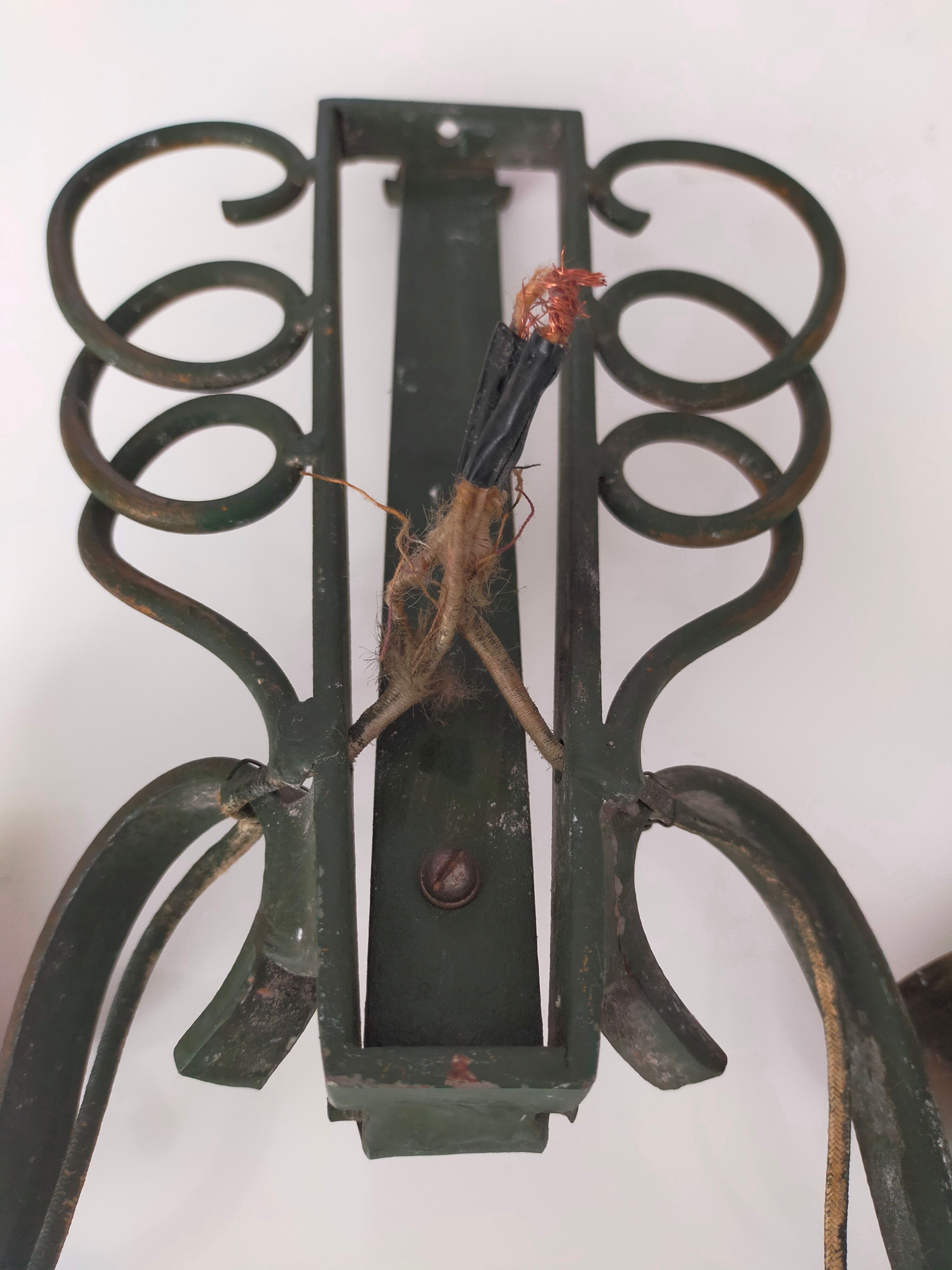 Pairs of vintage wrought iron wall lamps