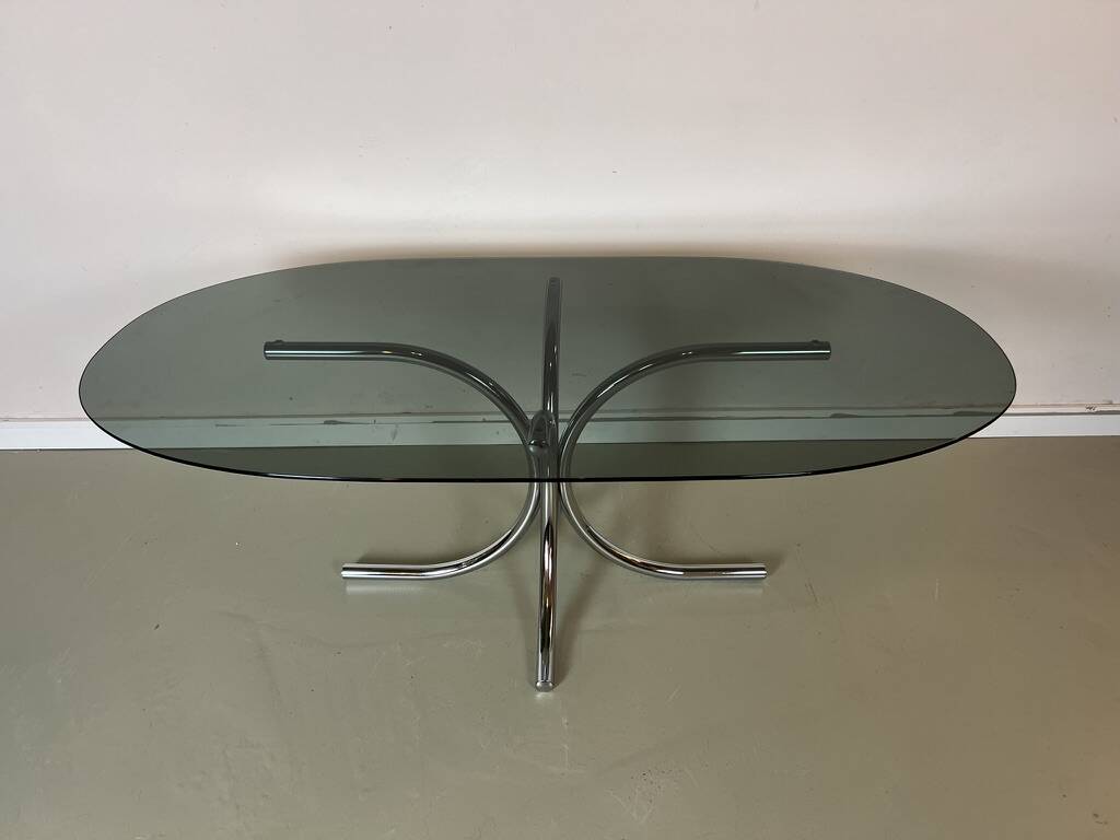 Vintage coffee table from the 70s in smoked glass and chrome, oval, Space Age style.