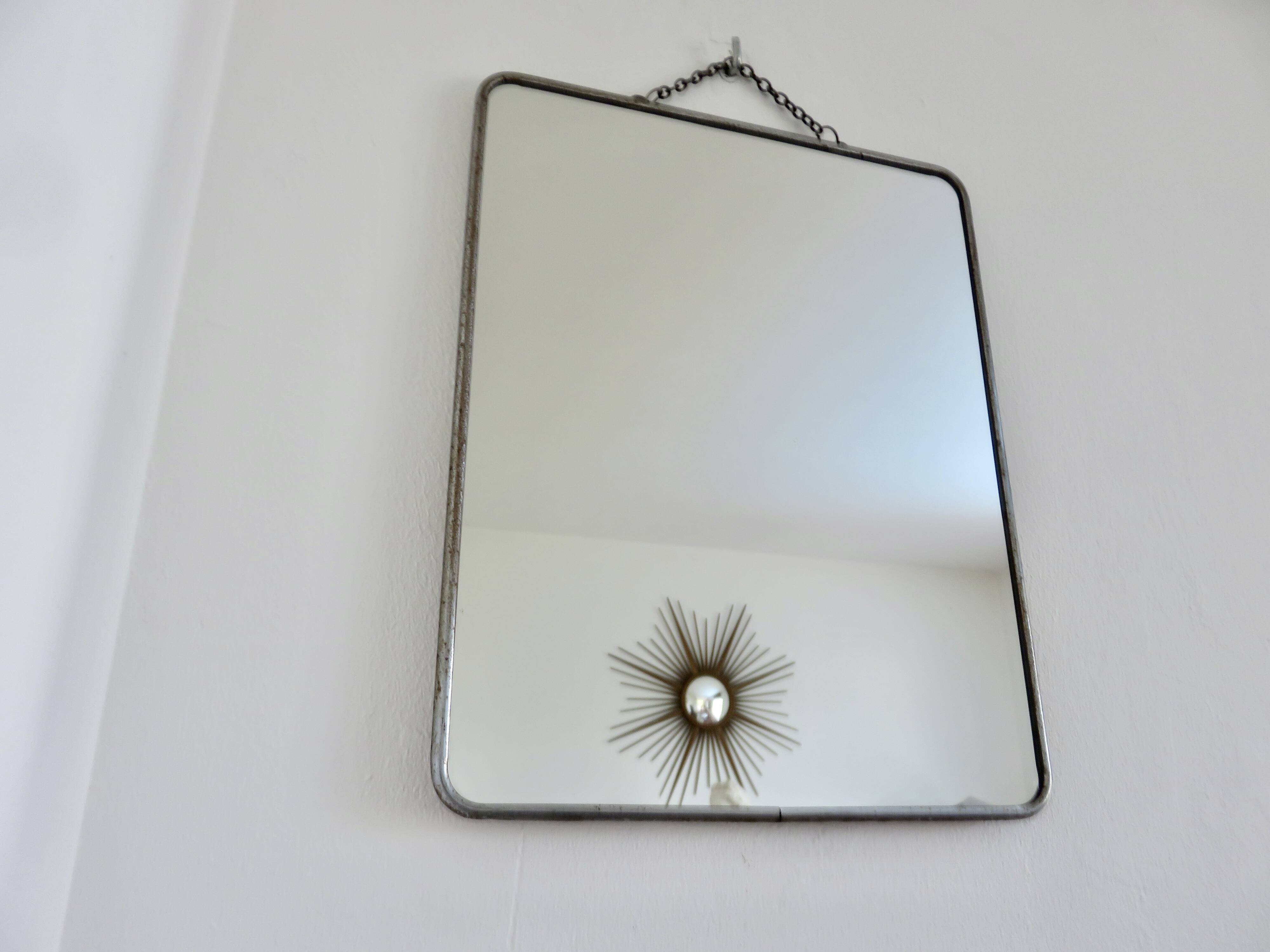 Old barber's mirror with chain, 1950s and 1960s