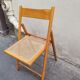 Wooden folding chair with caning from the 1980s.