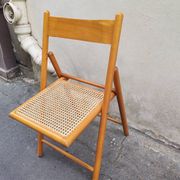 Wooden folding chair with cane from the 1980s.