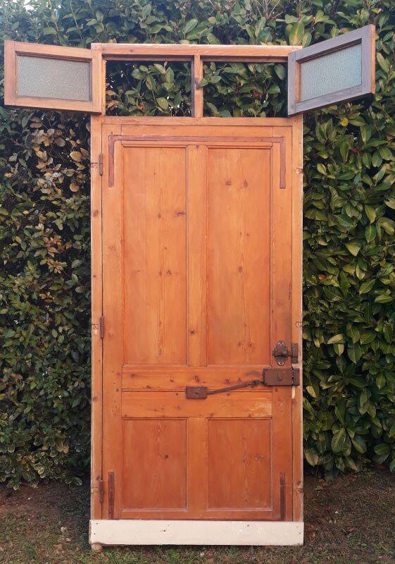 Front door and its frame, translucent glass windows, early 20th century