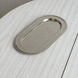 Small antique tray made of lightweight metal.