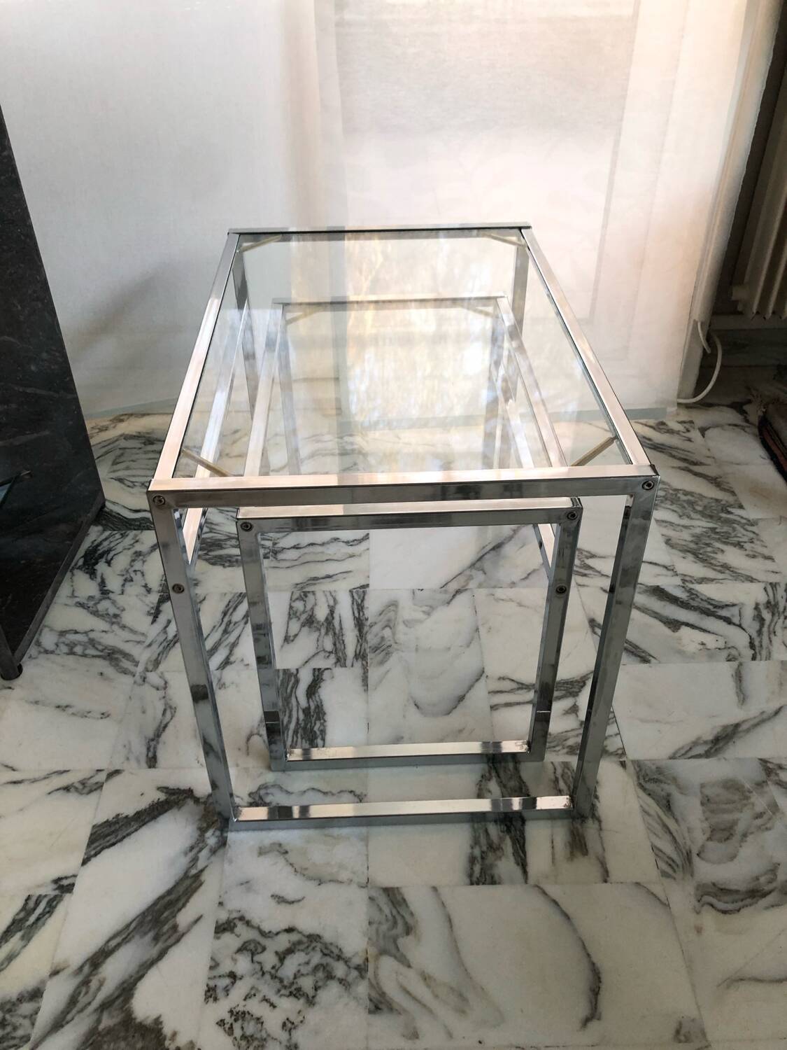 Nested tables in chrome metal and glass, Italy circa 1970.
