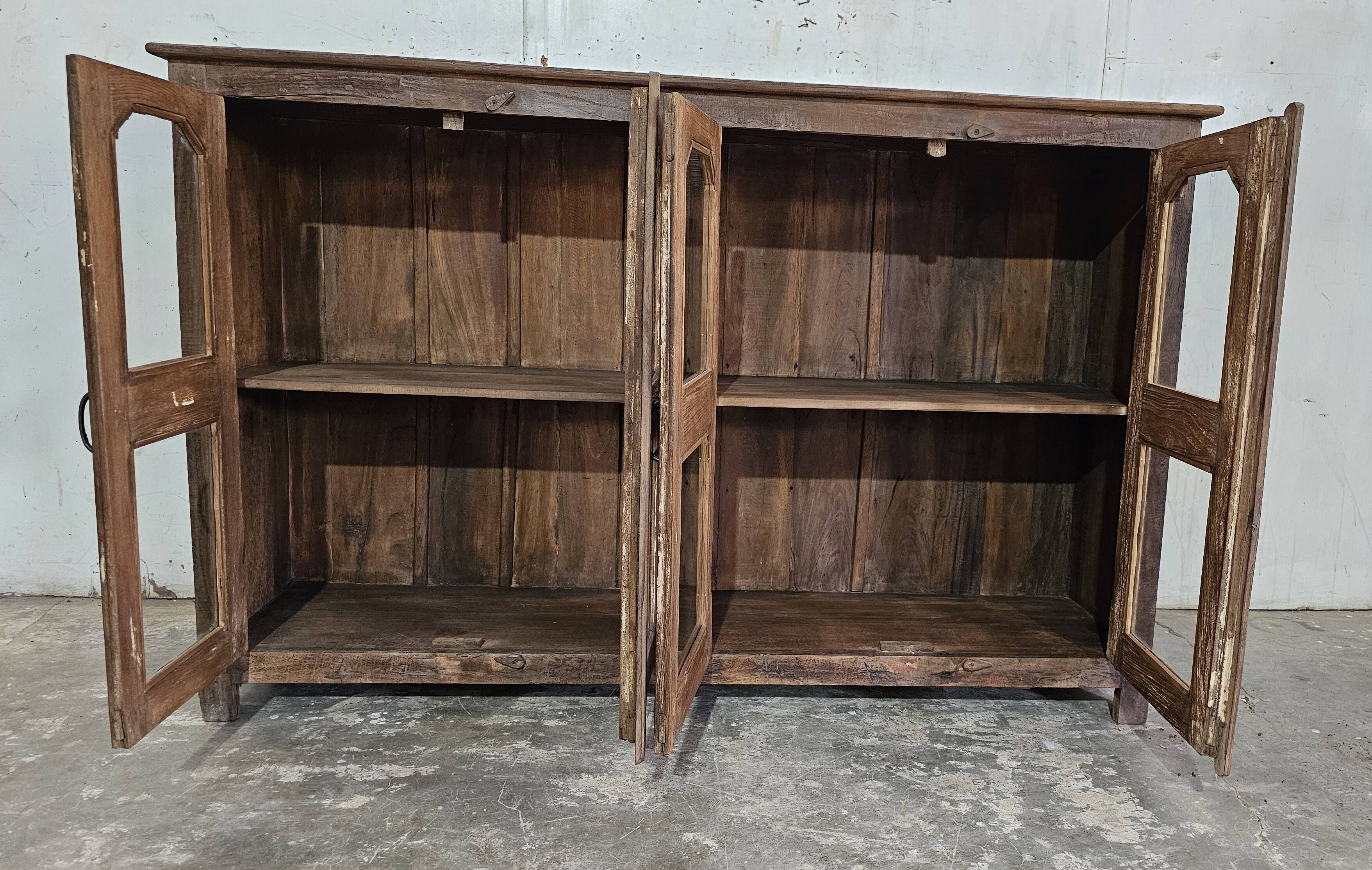 Antique glass-fronted buffet in Burmese teak