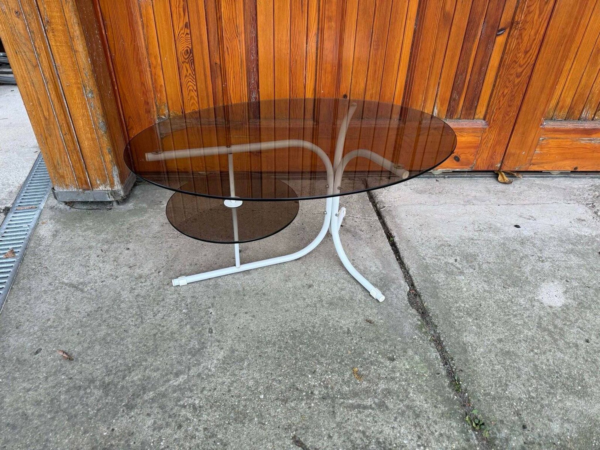 Coffee oval table with metal legs and smoky glass top, 1990s