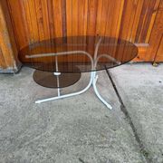 Coffee oval table with metal legs and smoky glass top, 1990s