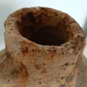 Textured terracotta vase in wabi-sabi style