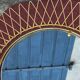 Vintage 1950s sun mirror in gold metal.
