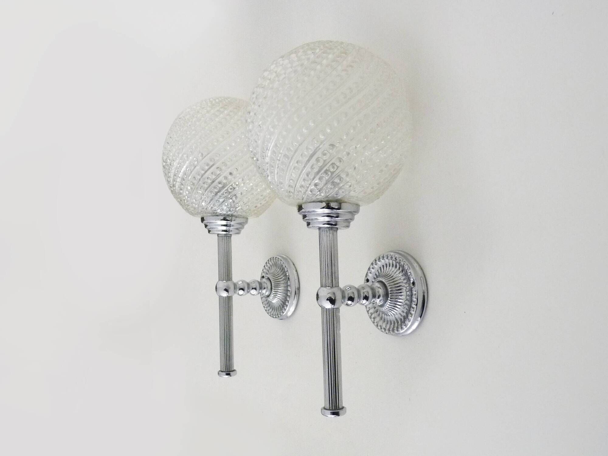 Pair of vintage Karl Lenz wall sconces. Chrome-plated metal and glass