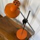 Orange articulated lamp design 1970