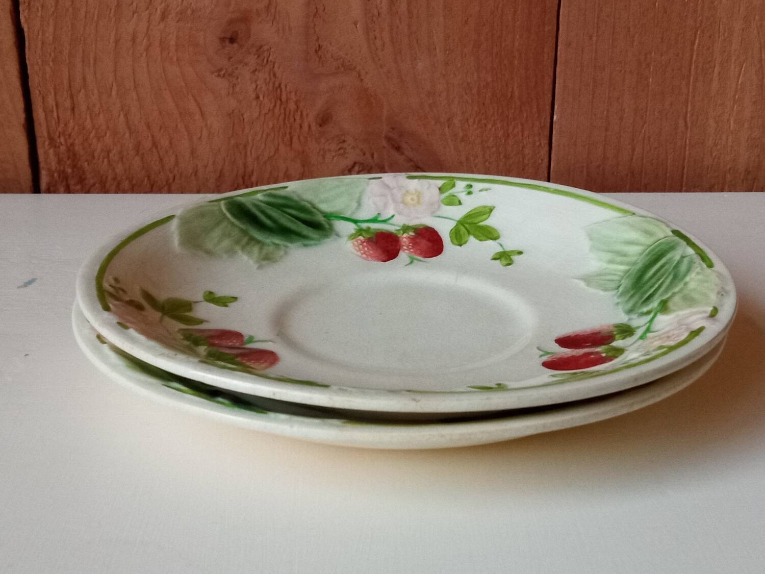 Two earthenware plates, H B, Choisy le roi