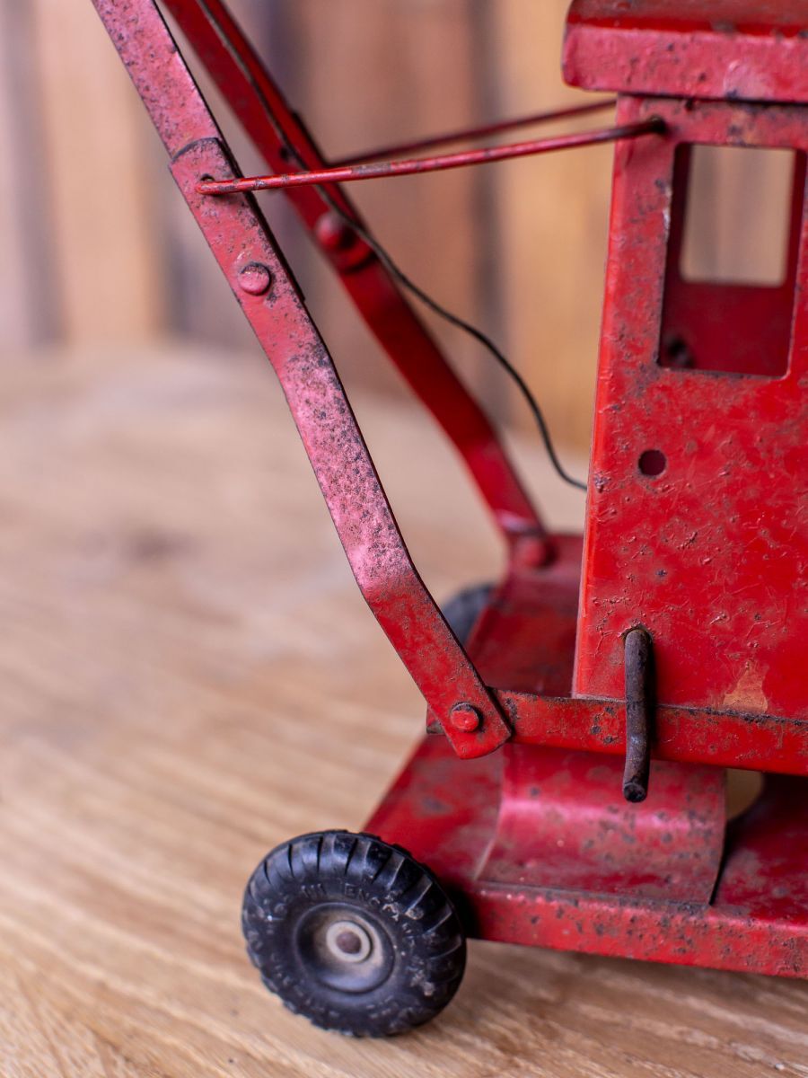 Old toy truck crane in sheet metal