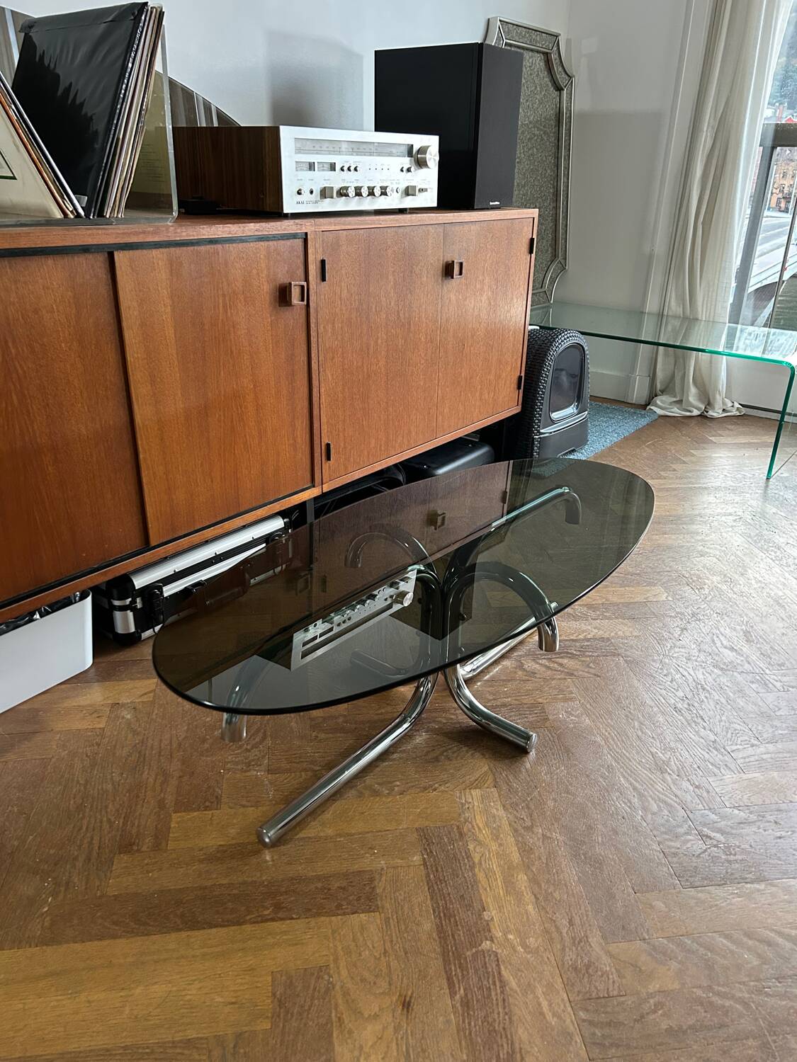 70s design oval coffee table in smoked black glass with chrome legs.