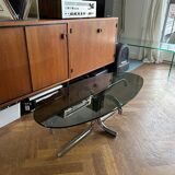 70s design oval coffee table in smoked black glass with chrome legs.