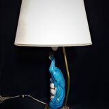 Large table lamp with earthenware peacock and beige silk lampshade