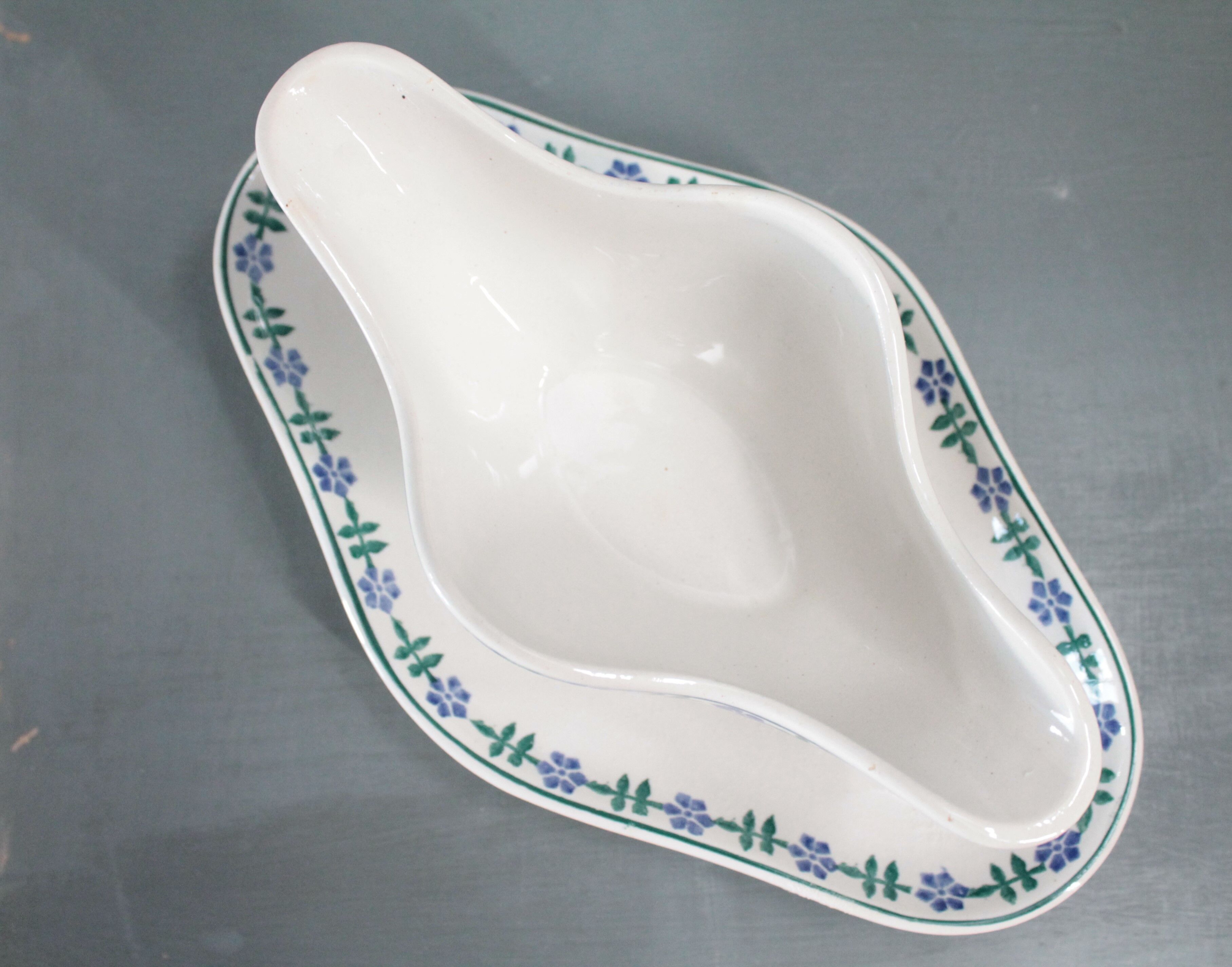 Old French white and blue gravy boat, in opaque porcelain, with blue flower pattern