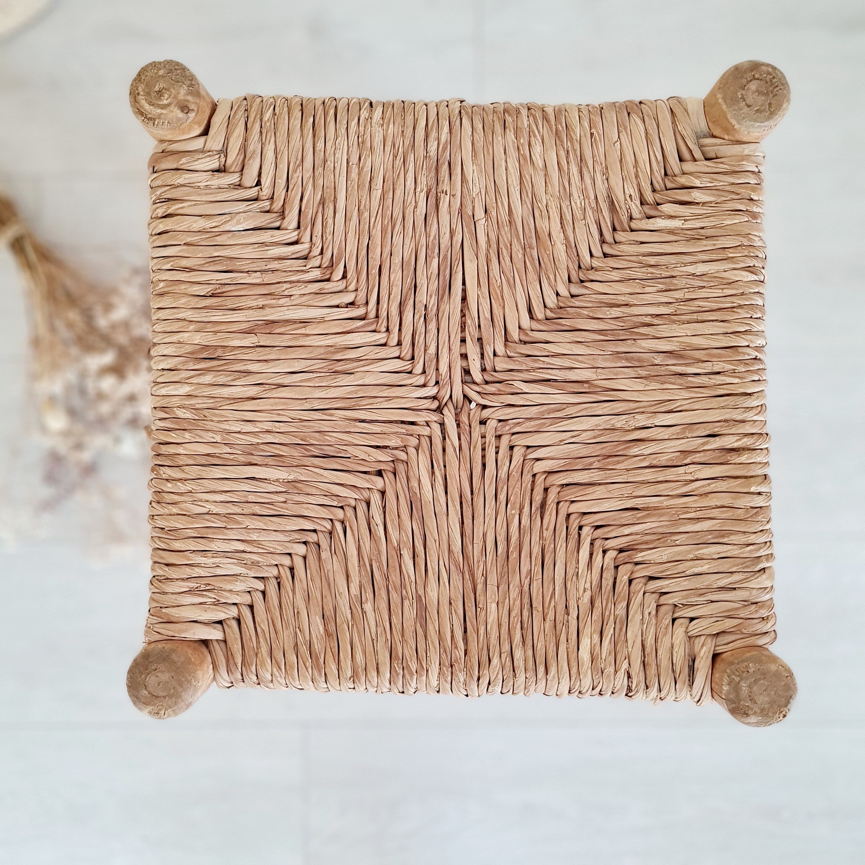 Old stool in wood and straw brutalist look