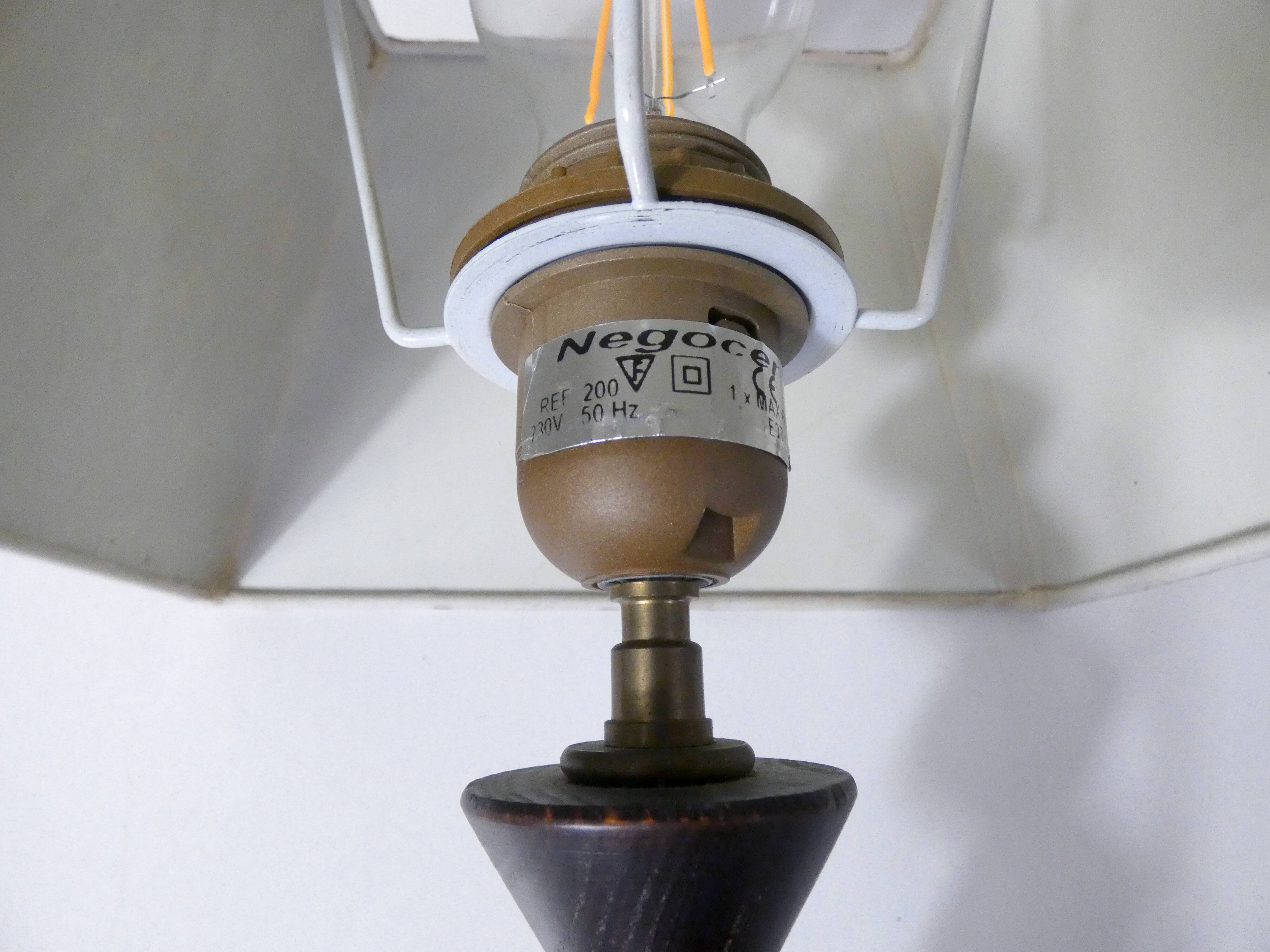 turned wooden lamp with spool base and vintage copper shade