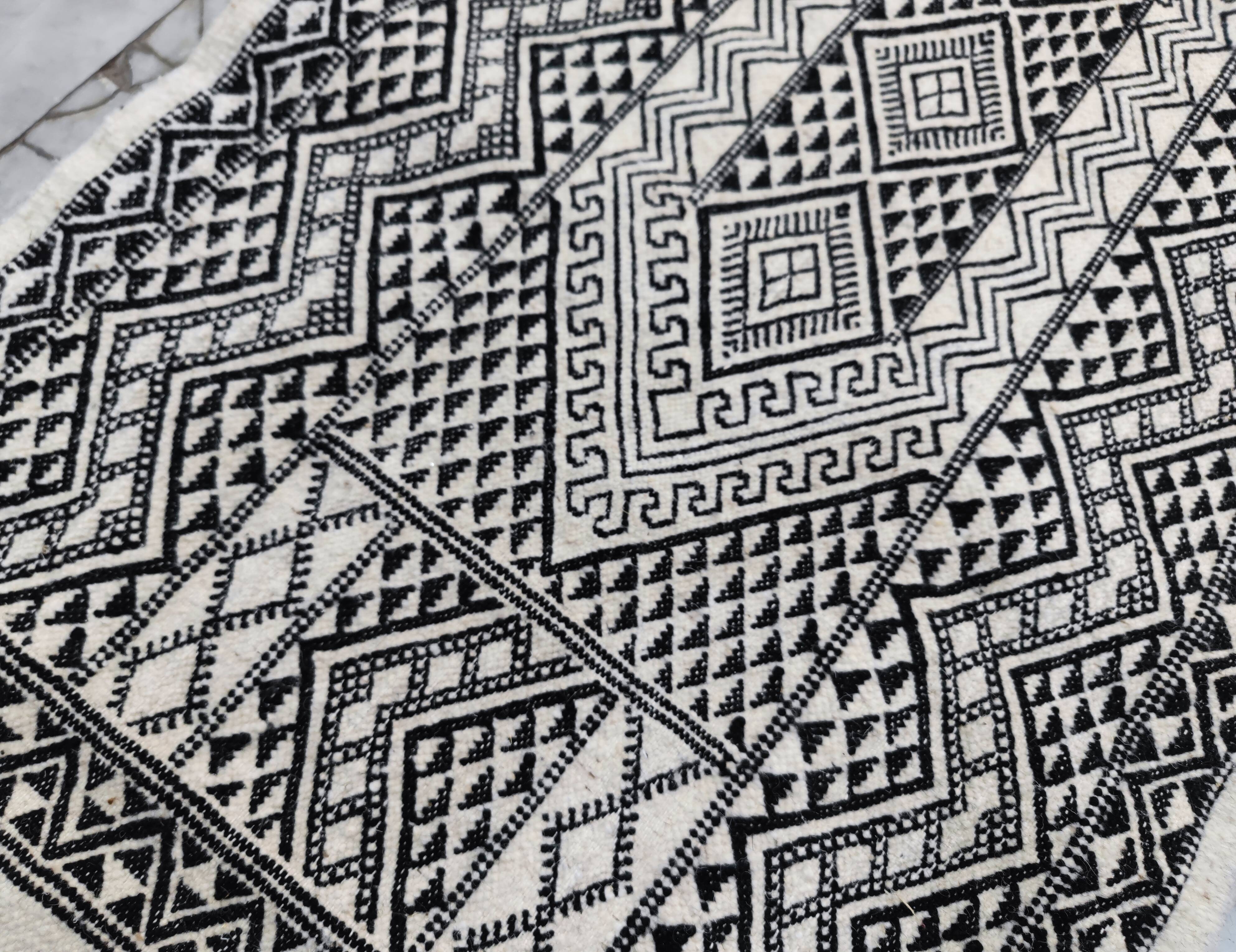 Handwoven black and white rug