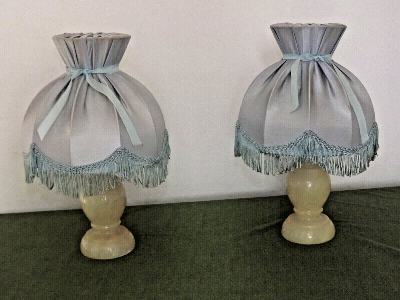 Pair of marble bedside lamps with blue satin fringed shades