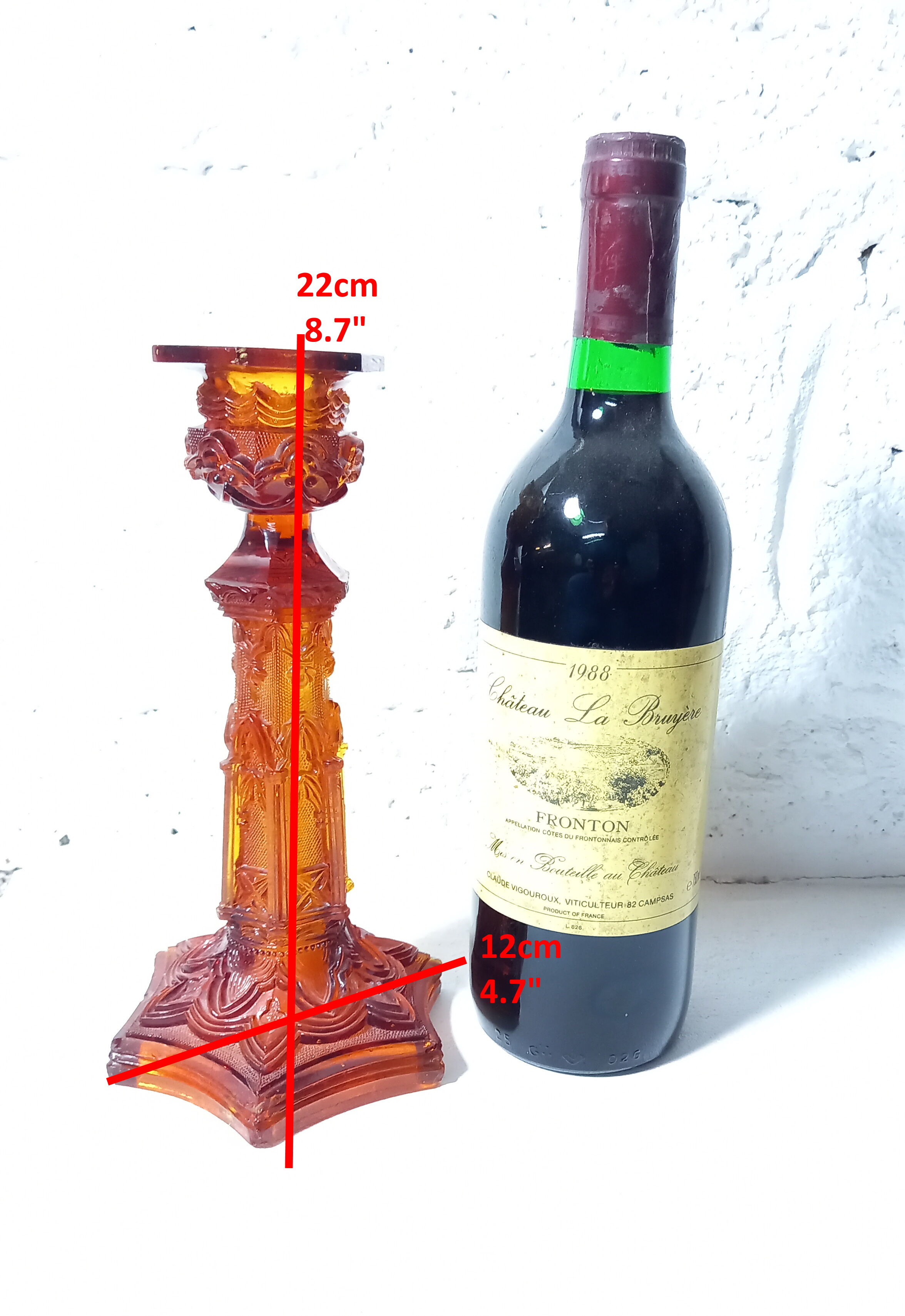 Pair of amber glass torches decorated with gothic motifs