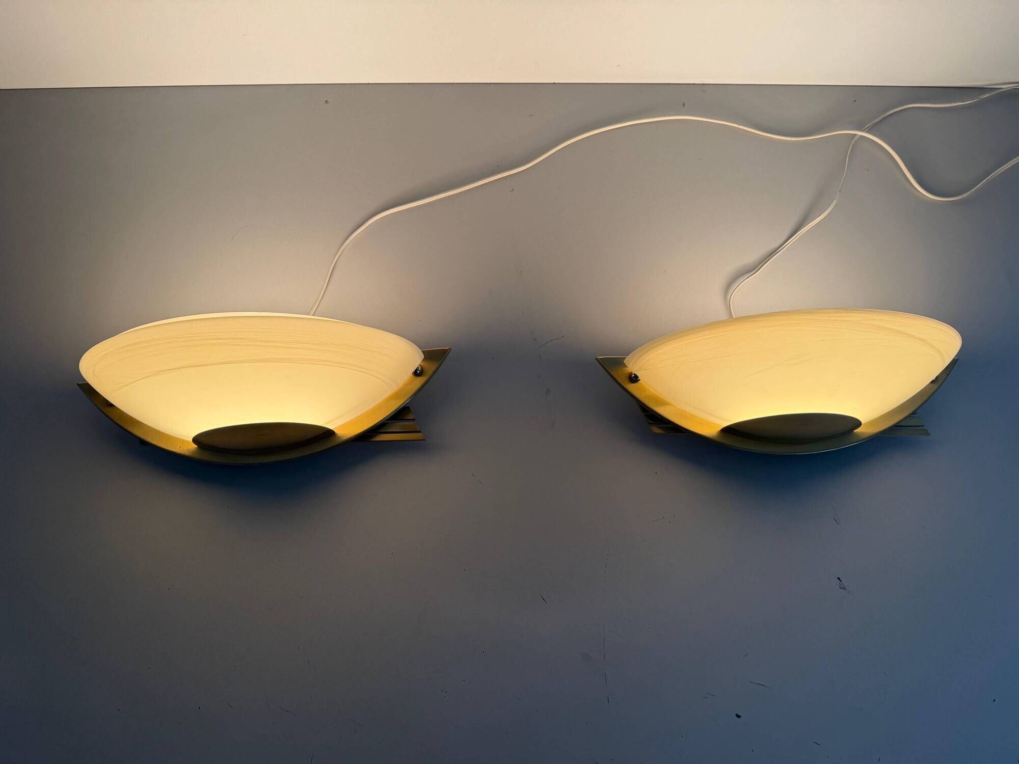 Pair of brass and glass wall lights from the Spage era, 1980, Germany.