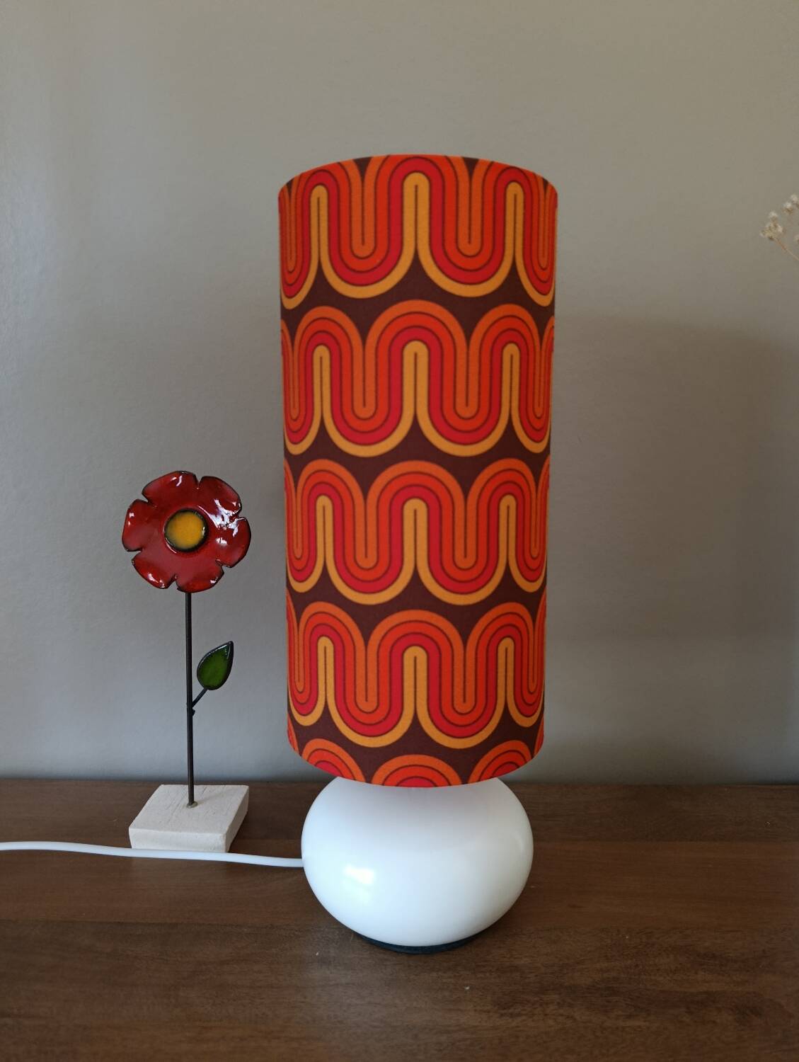 Two lamps with a seventies psychedelic wave print.