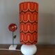 Two lamps with a seventies psychedelic wave print.