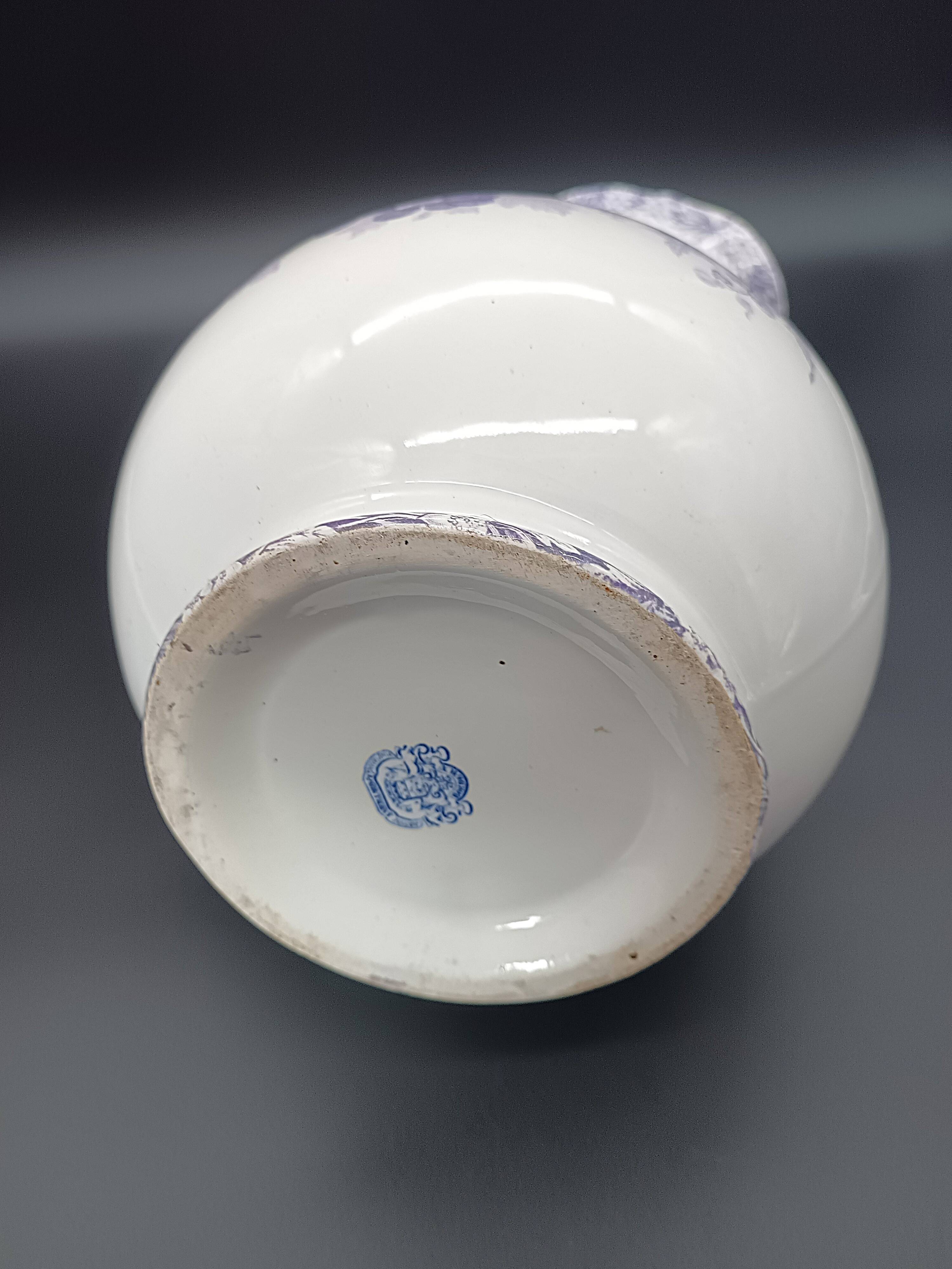 Large antique toilet bowl by Jules Vieillard Bordeaux with violet floral decoration.