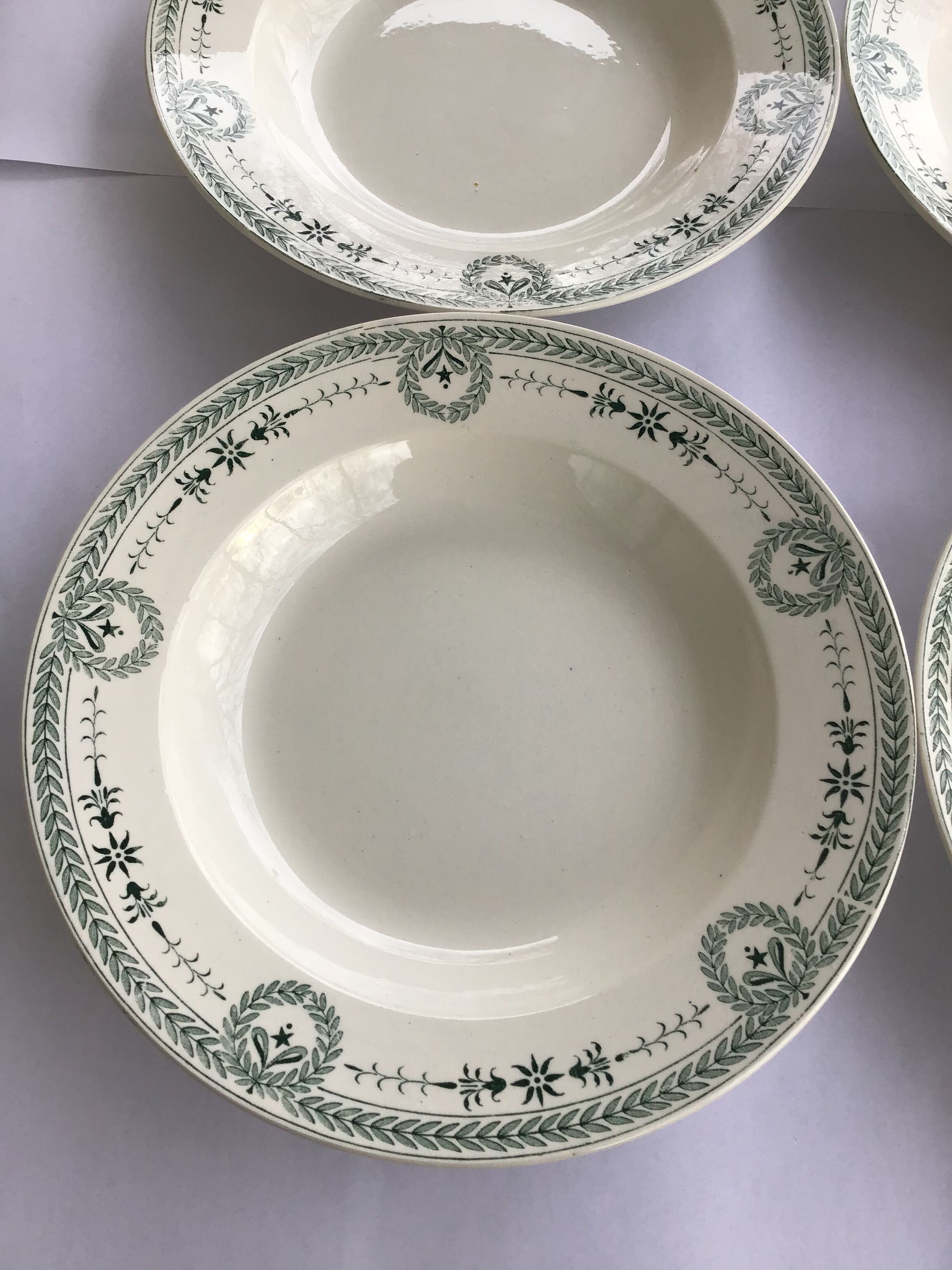 7 Old dark green Digoin hollow plates