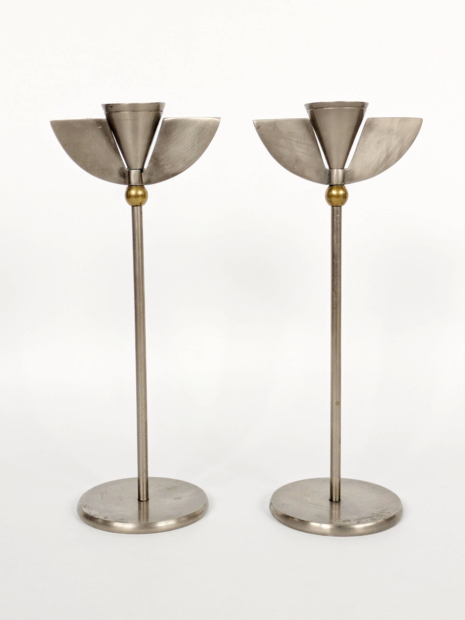 Pair of postmodern 1980s candlesticks, stainless steel and brass