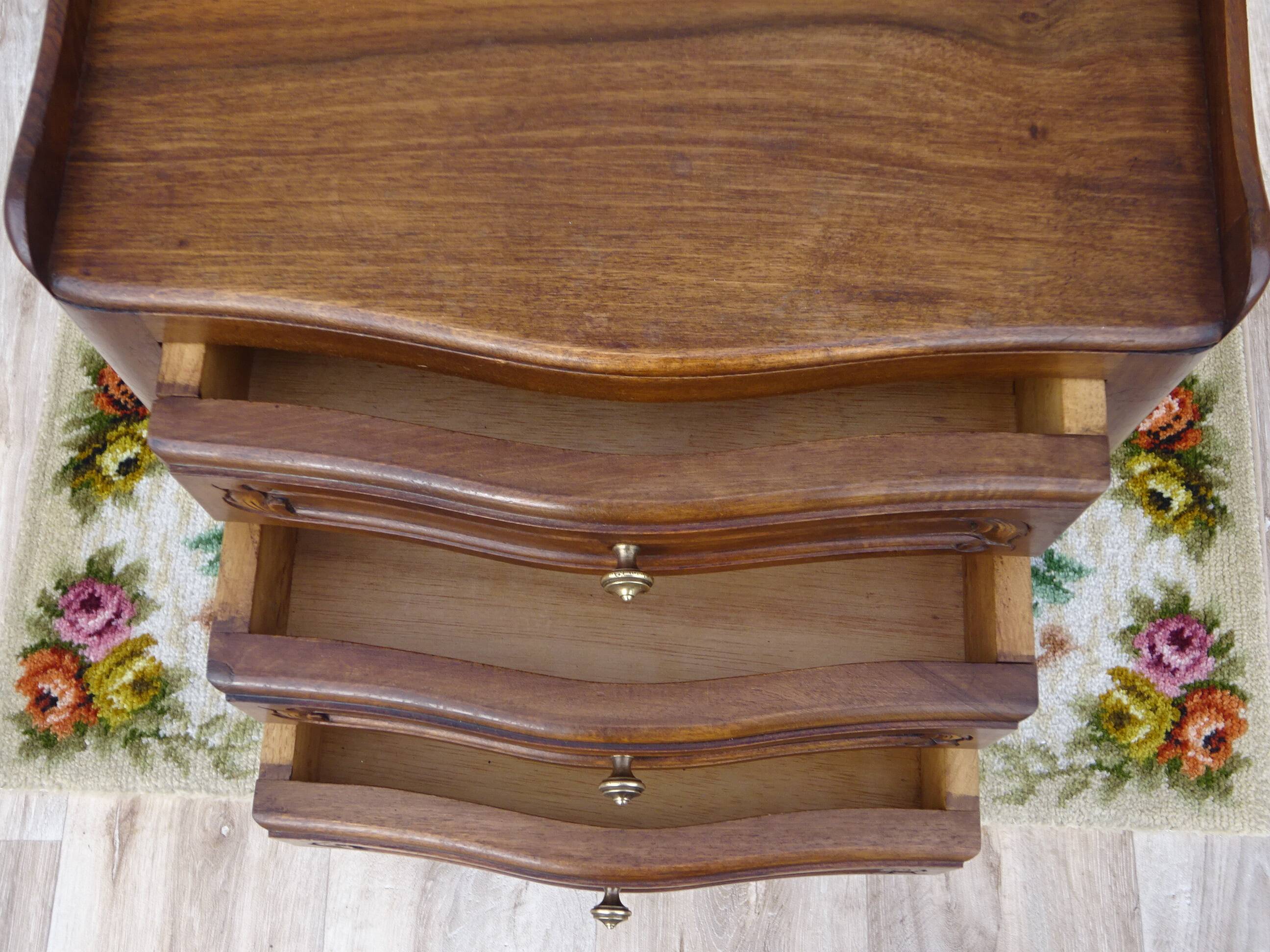 Louis XV bedside table in walnut, 3 drawers, raised edges on the tops.