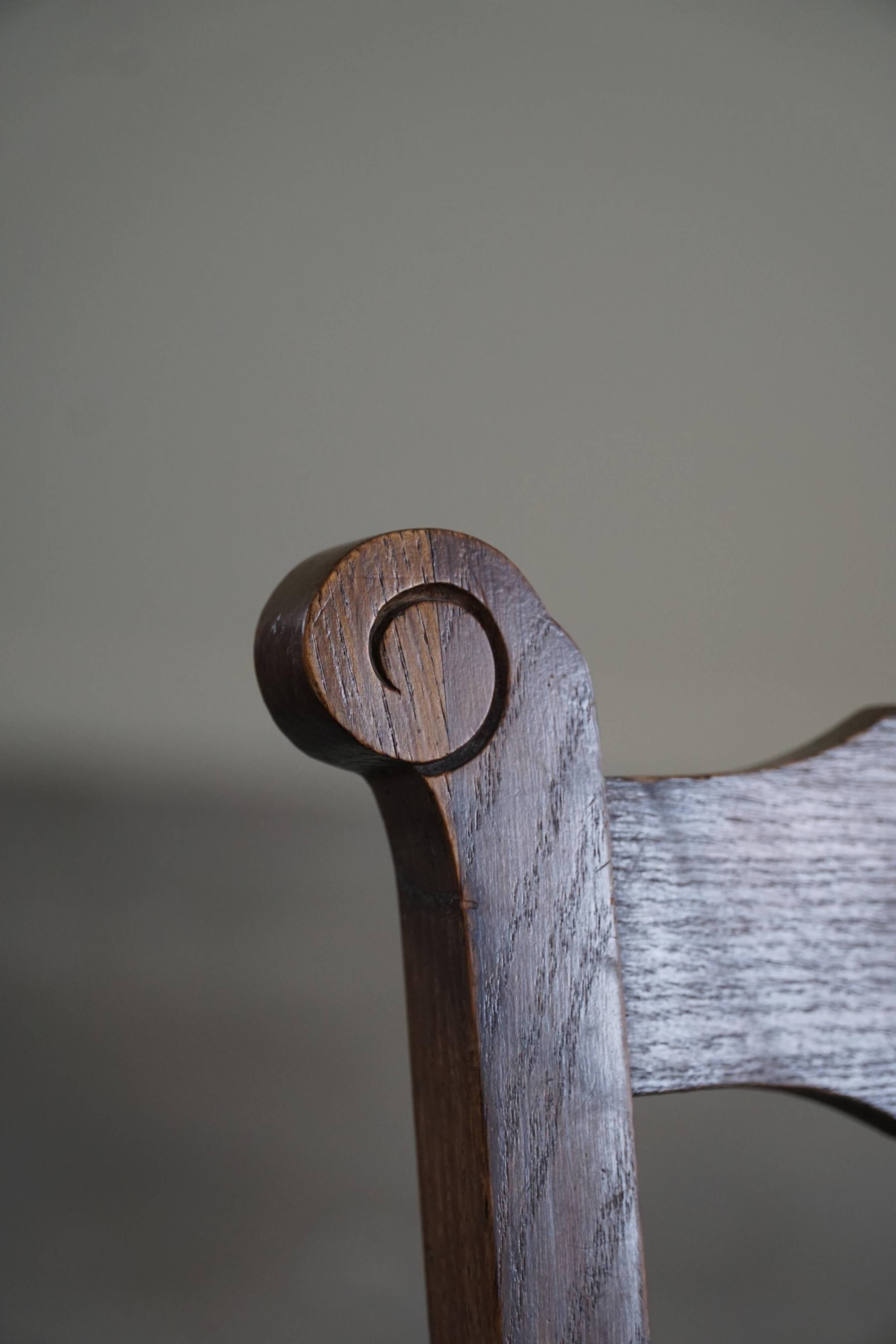 A pair of modern and sculptural vintage Danish armchairs in oak and papercord, 1940s.