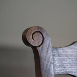 A pair of modern and sculptural vintage Danish armchairs in oak and papercord, 1940s.