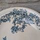 Shallow round plate Boch Frères model Regent with arabesque and foliage decoration.