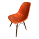 A vintage 70s Eames Herman Miller DSW Fiber Red Orange Dowel Walnut Chair